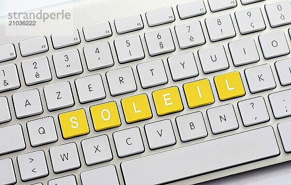 SOLEIL writing on white keyboard