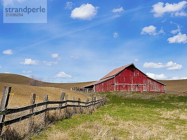 A bright red barn under a bright blue sky near Palouse  Washington