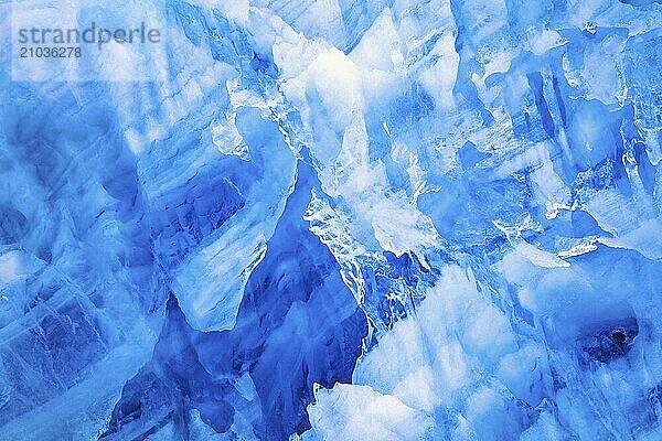 Abstract natural ice pattern on a glacier with blue colored ice  Svalbard