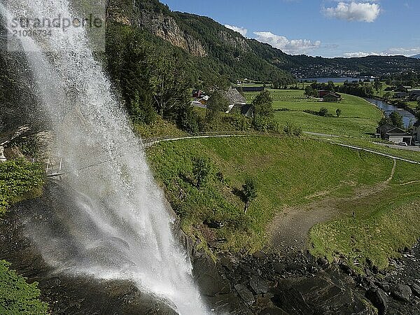 Waterfall of Steinsdalsfossen in Norway  in the background you can see the river Steinsdalselva