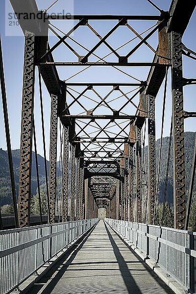 An old steel bridge repurposed into a walking path near Clark Fork  Idaho