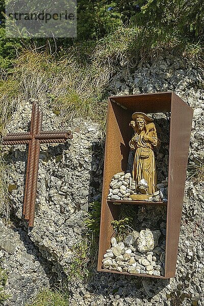 Religious symbol and holy figure in a box on a stony hill  oberstaufen  allgäu  bavaria  germany