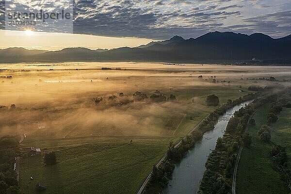 Aerial view of a river in front of mountains in the morning light  fog  autumn  Loisach  view of Benediktenwand  Alpine foothills  Upper Bavaria  Bavaria  Germany  Europe