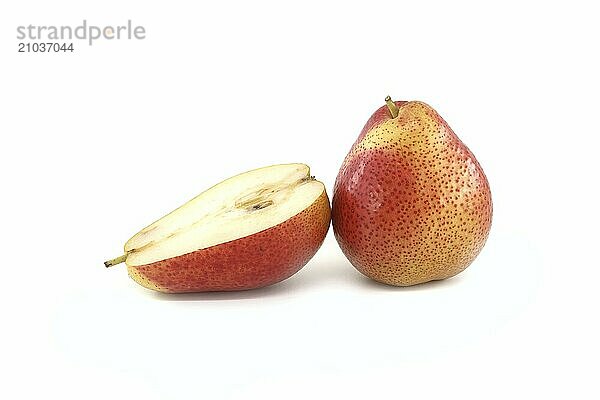 Fresh whole and half cut pear isolated on white background