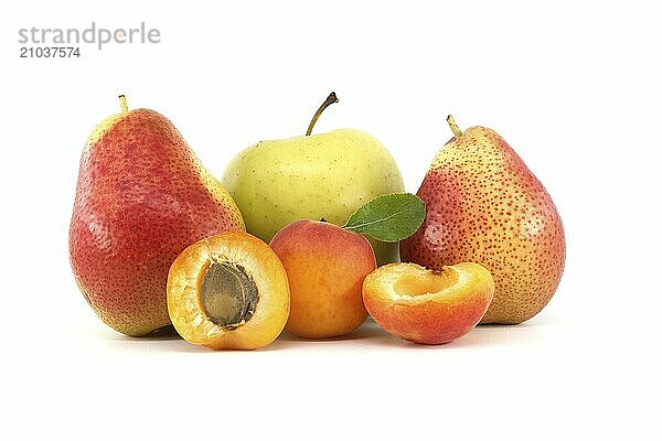 Whole and halved ripe apricots  multicolored pears and green apple isolated on a white background. Multivitamin and juicy rich fruits