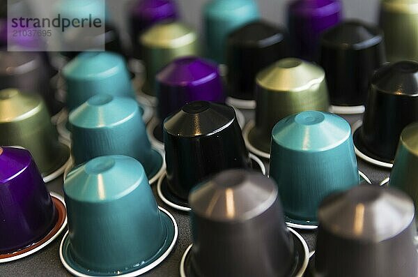 Beautiful colored coffee capsules on black background