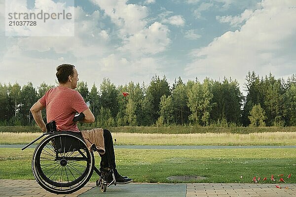 An old man in a wheelchair opens his hunting rifle to reload the cartridges. The frame shows shell casings flying out of the barrel