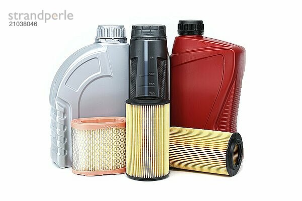 Car oil filters elements and motor oil can isolated on a white background. Oil and filter replacing maintenance or car servicing  automotive industry