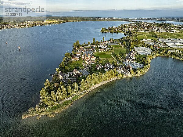 Aerial view  of the north-western tip of the island of Reichenau in Lake Constance  with the district of Niederzell and the columned basilica of St Peter and Paul  with Windegg Castle on the shore  district of Constance  Baden-Württemberg  Germany  Europe