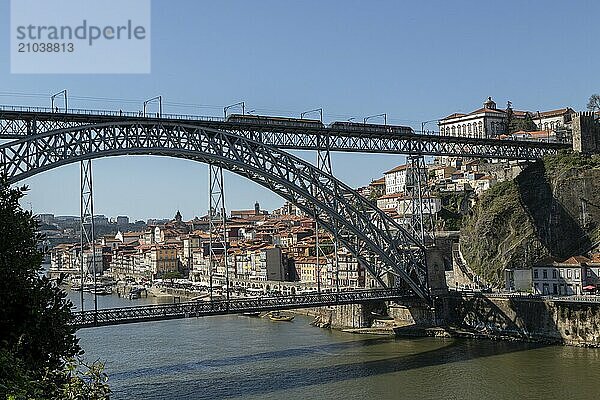 Place of interest  architecture  view from Vila Nova de Gaia to the bridge Ponte Dom Luis I with light railway of the Metro do Porto and the old town of Porto  Portugal  Europe