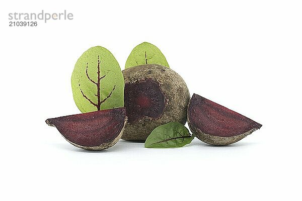 Slices of beetroot  revealing their vibrant purple interiors  are neatly arranged beside whole beetroot vegetables  complete with their fresh green leaves  all set against an isolated white background