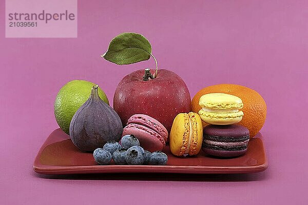 Assortment of macarons and fruit. Baked goods and fresh fruits add a burst of color and freshness  full depth of field image