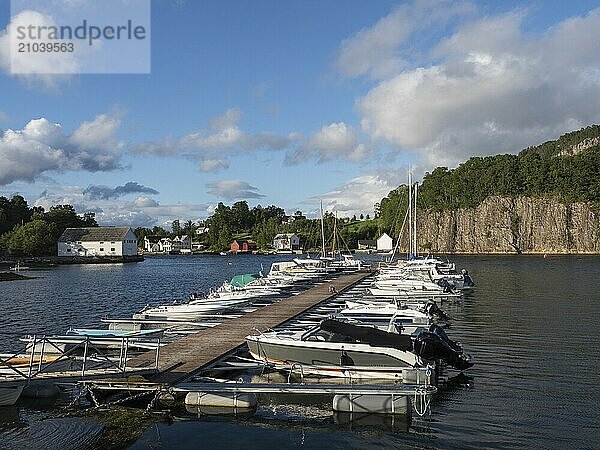 Sailboats and motorboats moored in the harbour at Vinnesholmen in Björnafjorden  Norway  Europe