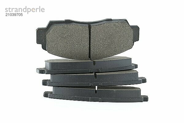 New disc brake pads isolated on white background  brake parts  replacement parts for vehicle