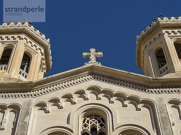 Detailed view of the upper structure of a church with towers and a cross against a blue sky  Dubrovnik  Mediterranean Sea  Croatia  Europe