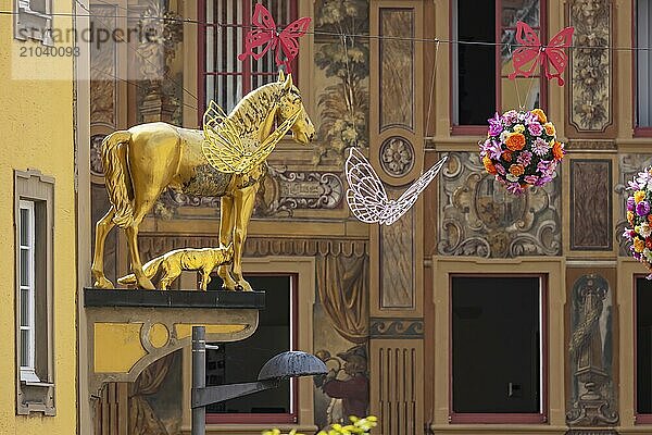 Town view of Ellwangen  Zimmerle house with magnificent façade painting. Today Adler pharmacy  formerly a post inn. Sculpture of a golden horse. Ellwangen  Baden-Württemberg  Germany  Europe