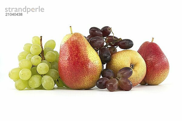 Assortment of fresh healthy fruits including multicolored mango  pears  red and green grapes isolated on a white background