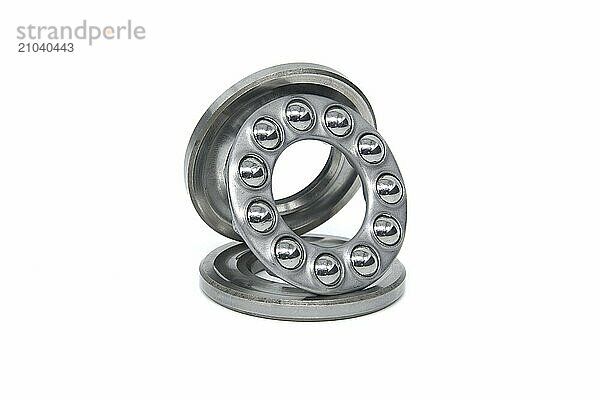 Thrust ball bearing isolated on white background  spare parts for machinery and automotive industry  full depth of field