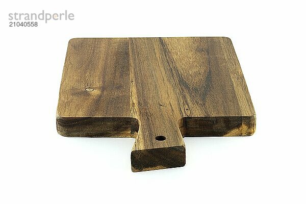 Wooden cutting board with a handle  made from old  thick wood  and bears a rustic  vintage appearance characterized by cracks  scratches  isolated on a white background