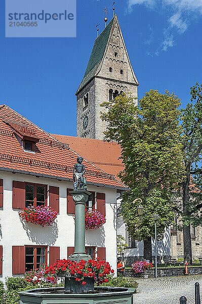 Church tower with clock of the parish church of St Martin and Mohrenbrunnen  Obergünzburg  Allgäu  Bavaria  Germany  Europe