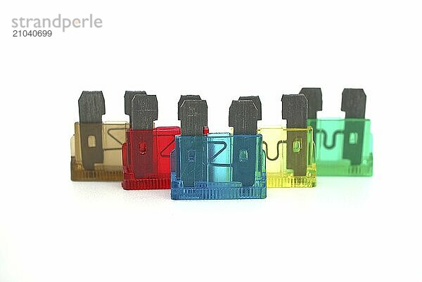 Various colored automobile fuses with open circuit used to protect the wiring and electrical equipment for vehicles isolated on white background. Blown fuse