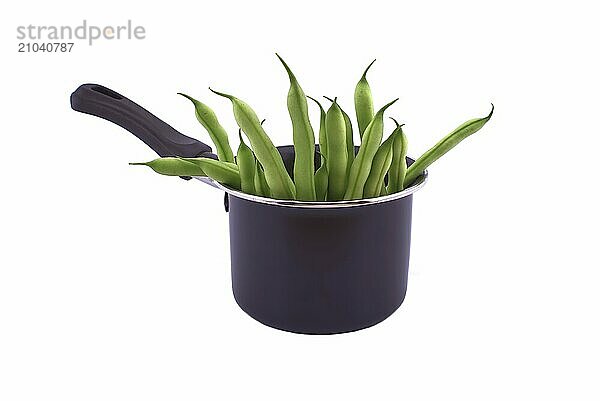 A handful of green beans in the pot isolated on white background. Healthy  nutritious vegetarian food