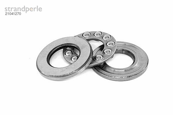 Thrust ball bearing isolated on white background  bearing are stacked upon each other  showcasing the inner structure