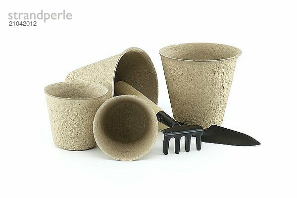 Peat pots for germination or seedlings isolated on white background. Biodegradable compostable nursery pots for vegetables herbs flowers