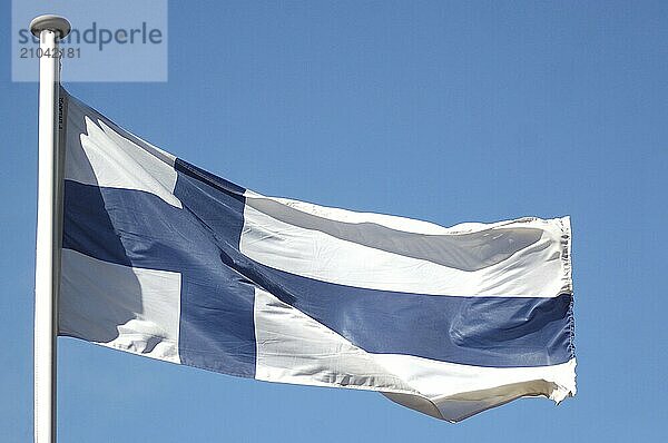 The flag of Finland against blue sky