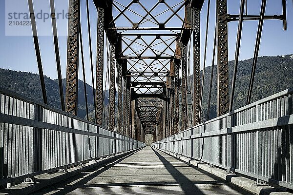 An old steel bridge repurposed into a walking path near Clark Fork  Idaho