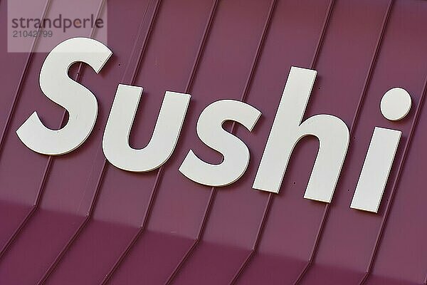 The lettering Sushi on a red background  plain  Toronto  Ontario  Canada  North America