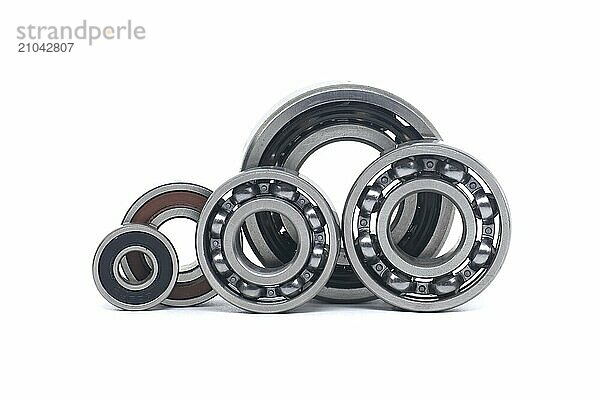 Array of bearings of varying sizes and types  including with and without sealing isolated on a white background