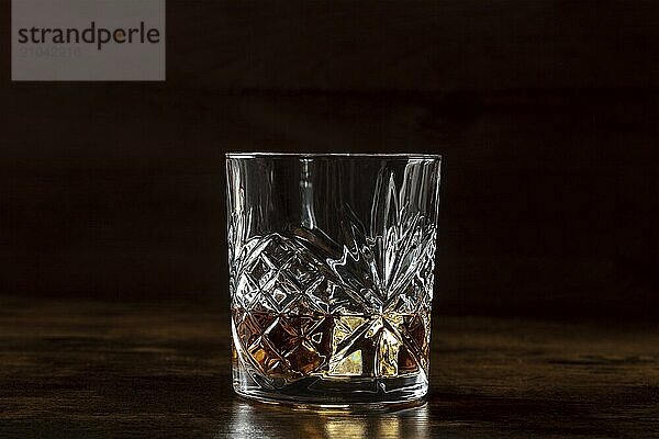 Whiskey in a glass with ice. Bourbon whisky on rocks on a dark background  a luxury drink  Food photography  Food photography