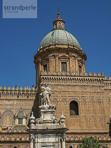 Gothic church with dome and impressive statue in the foreground under a clear summer sky  palermo  sicily  mediterranean sea  italy