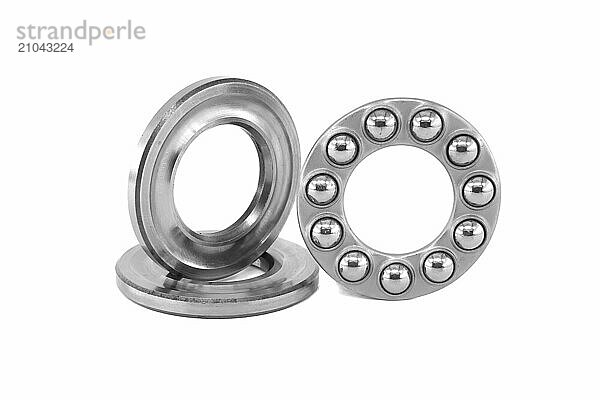 Thrust ball bearing isolated on white background  bearing are stacked upon each other  showcasing the inner structure