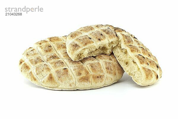 Pita flat-breads isolated on a white background. The detail and texture of the pita bread are highlighted  giving it a fresh and appetizing look