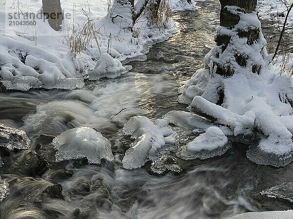 The icy Tannbach between Bavaria and Thuringia