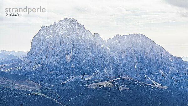 The peaks of the Sassolungo Group against the light  drone shot  Val Gardena  Dolomites  Autonomous Province of Bolzano  South Tyrol  Italy  Europe