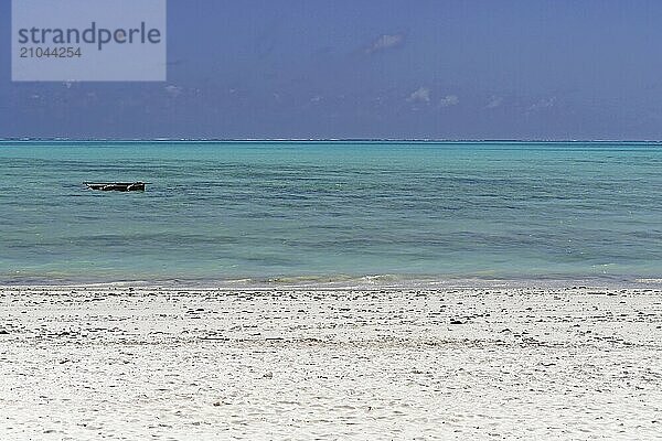 Turquoise water and sand beach at island Zanzibar