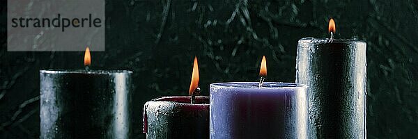 Burning candles on a dark background  mysterious ritual panorama  Food photography