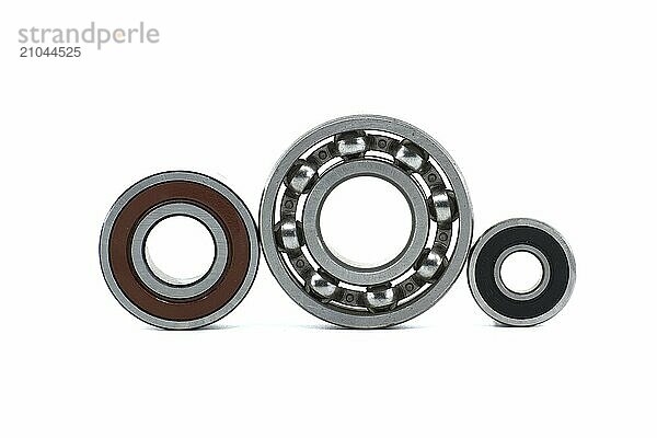 Various ball bearings isolated on white background. Spare parts for machinery and automotive industry