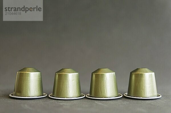 Beautiful colored coffee capsules on black background