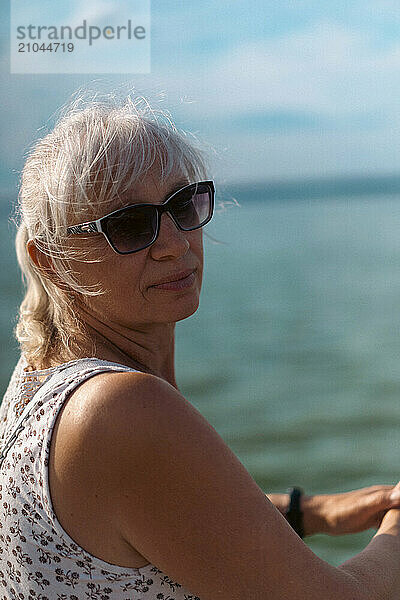 Portrait of smiling senior woman outdoors.