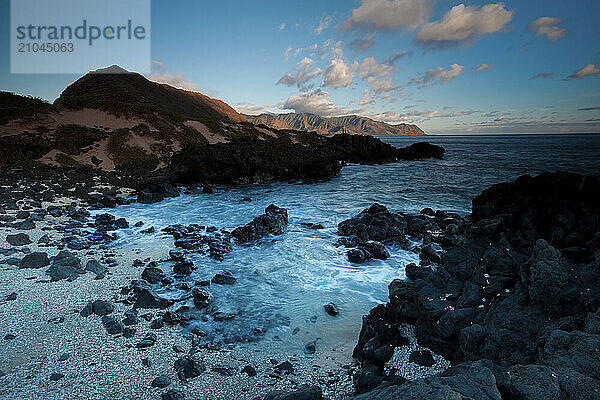 Oahu's western most tip looks back on some of Oahu's jaggedly steep mountains.