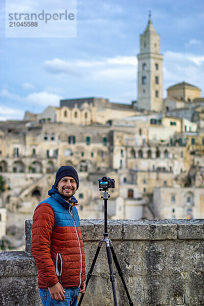 Man photographer looking and smiling at the camera in Matera  Italy