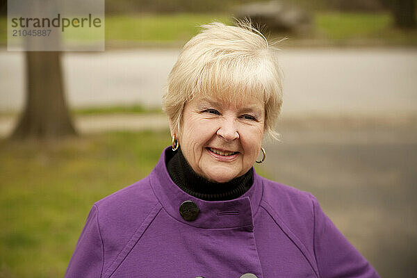 Smiling senior woman outdoors.