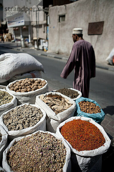 Arab walking through spice market in the Bur Dubai Souk.