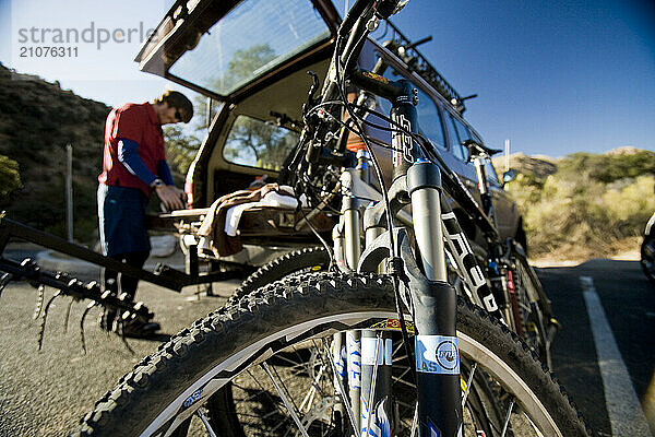 A man prepares for a mountain bike ride.