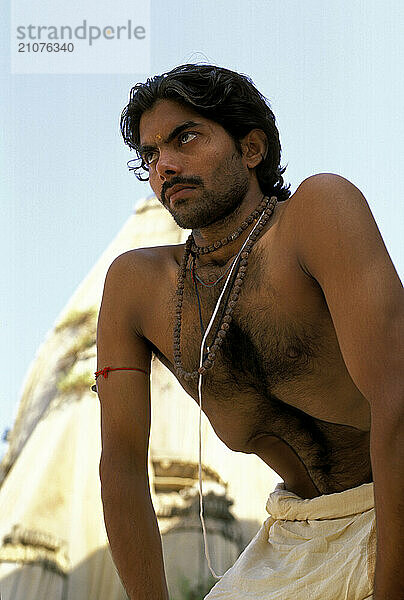 A Yogi Priest practices by Yoga near the Ganges River  Varanasi  Uttar Pradesh  India.