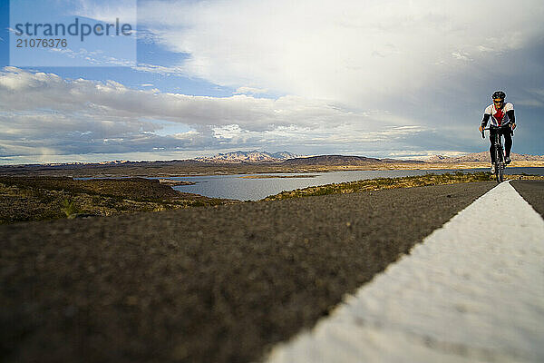 A road cyclist riding around Lake Mead  Nevada.